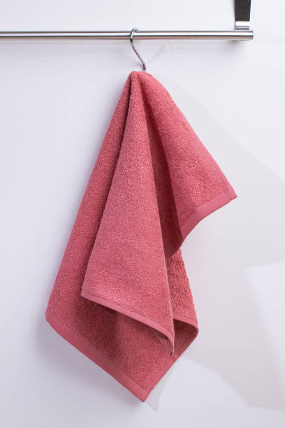 istock a terry towel hangs on a metal bracket attached to the wall 2150205512