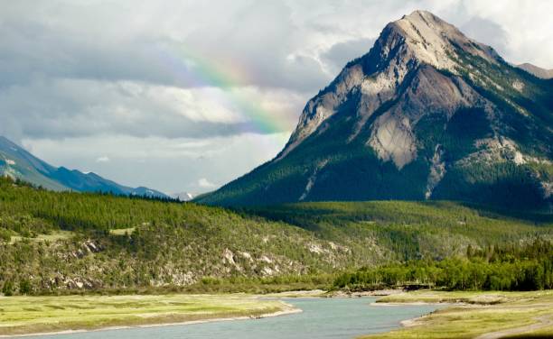 istock Beautiful rainbow across the mountain 2150211683
