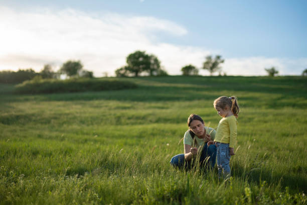 istock Family Day. Mom & Kid in Nature in Spring. 2150214874