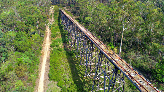 Drone views of an old wooden trestle railway bridge in East Gippsland