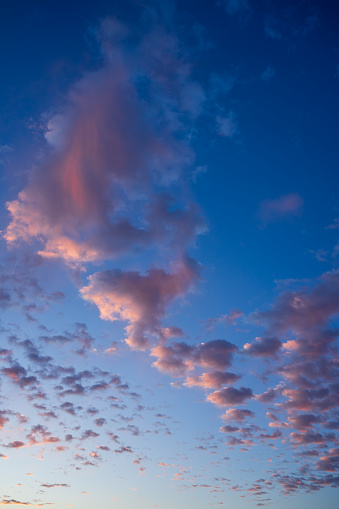 Awesome clouds hold the pink hues of sunrise