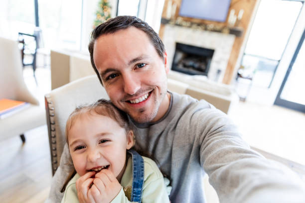 istock Silly young daughter smiles with her dad 2150223843