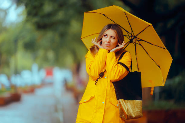 Stressed adult walking through the rain on a stormy day