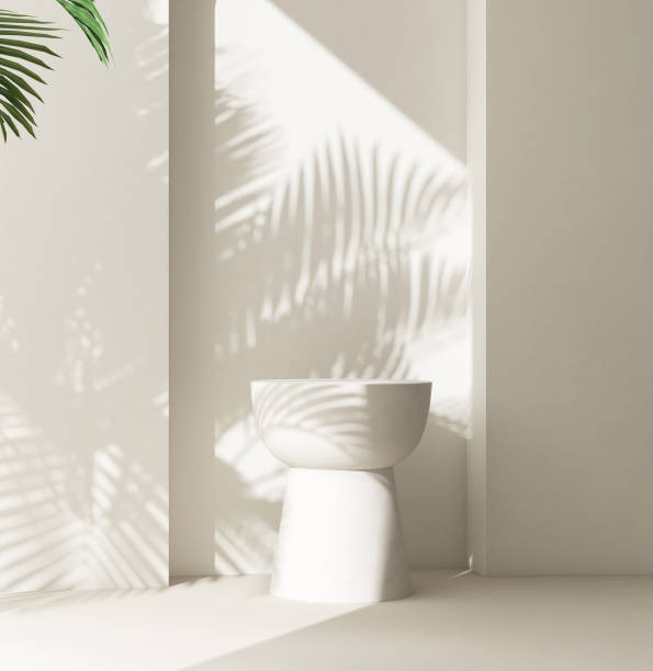 istock Cream white round podium table in sunlight, palm tree leaf shadow on wall 2150225937