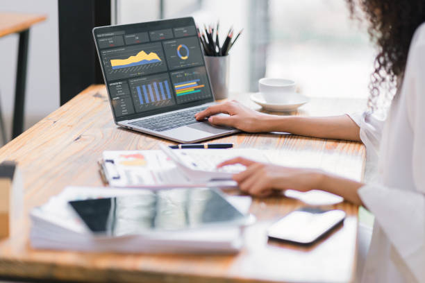 istock Businesswoman or accountant analyzing data charts, graphs, and dashboard on laptop screen to increase sales and revenue. Business data analytics concept. 2150226405