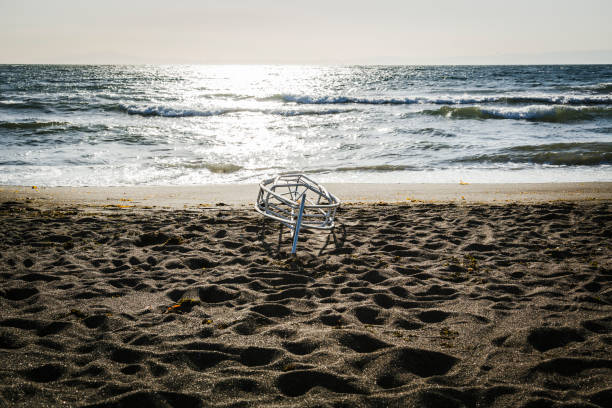 Steel frame of kayak without main body on seashore.
