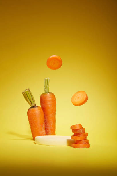 istock Yellow background against on vegetable layout with carrot is the main ingredient from front view. Photo for designing advertise pics of product made from carrot 2150230323
