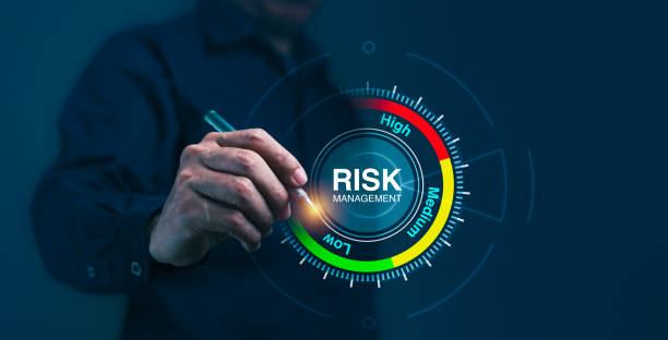 istock A man is pointing at a risk management level on a screen 2150230352