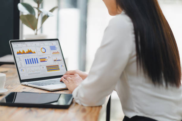 istock Business professional analyzing sales performance dashboard on laptop screen. 2150230457