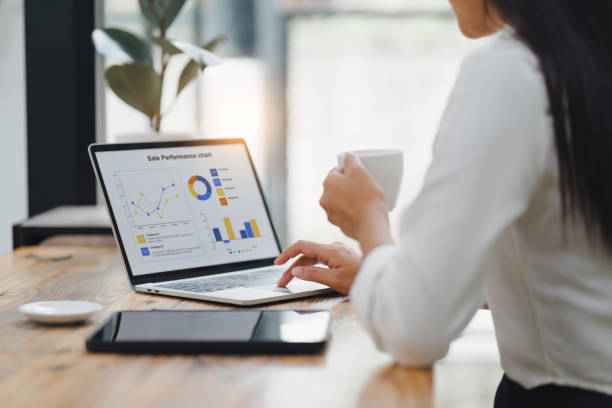 istock Businesswoman interacts with a digital sales dashboard displaying various performance metrics and analytics. 2150230458