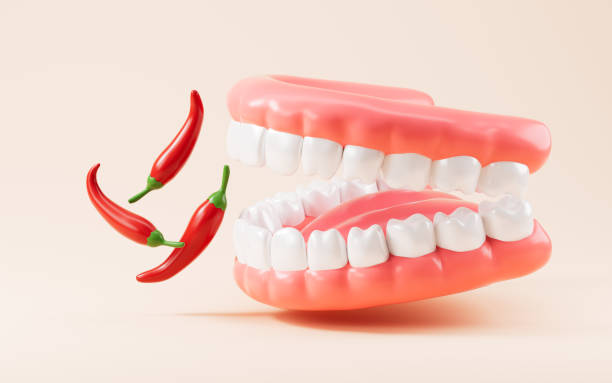istock Cartoon teeth and chilli, diet and oral hygiene concept, 3d rendering. 2150230523