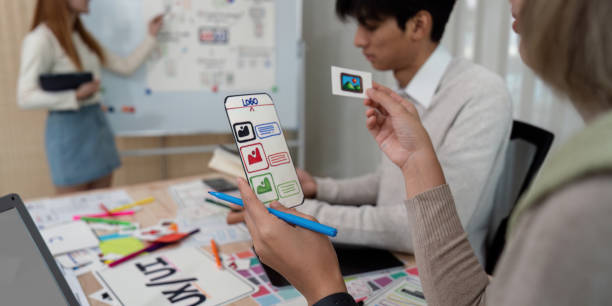 istock Brainstorm team of creative web graphic designer planning, Group of mobile phone app developer team meeting for share ideas about screen prototype layout for smartphone. startup planning ui and ux 2150231128