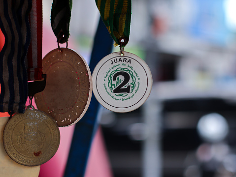 Bandung, Indonesia - July 9, 2022 : Various kind of medals over the blurred background
