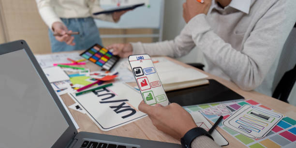 istock Brainstorm team of creative web graphic designer planning, Group of mobile phone app developer team meeting for share ideas about screen prototype layout for smartphone. startup planning ui and ux 2150231145