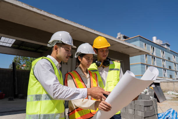 istock Construction of engineer or architect meeting for project working with partner and engineering tools on building and blueprint in working site 2150233008
