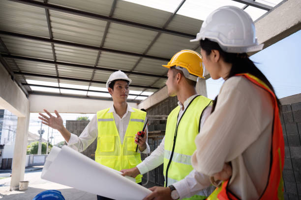 istock Construction of engineer or architect meeting for project working with partner and engineering tools on building and blueprint in working site 2150233052