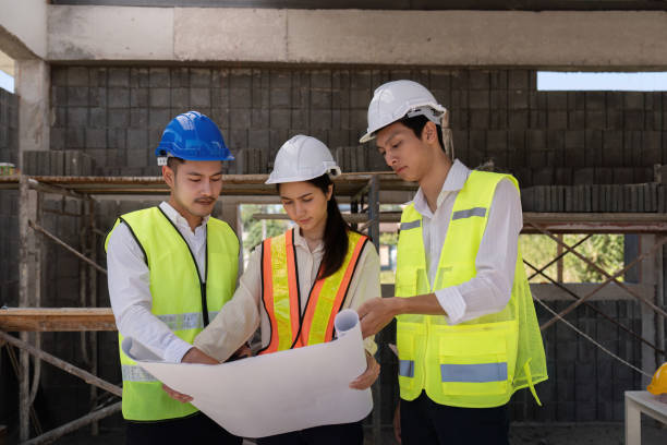 istock Construction of engineer or architect meeting for project working with partner and engineering tools on building and blueprint in working site 2150233053