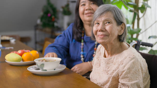 istock Daughter prepare lunch for elderly mother with soup. 2150237414