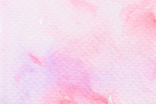 An hand painted pink watercolor background. There is a slight texture of paint pooling and drips.