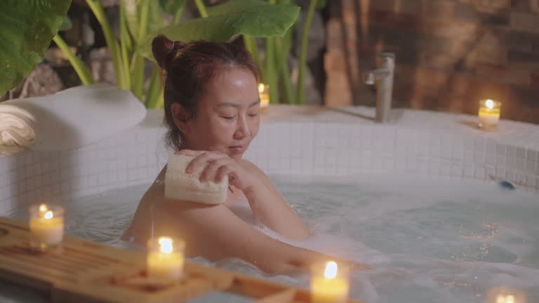 Serene Candlelit Bathing Ritual, Handheld slow-motion capture