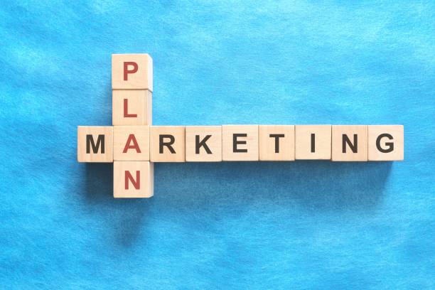 Marketing plan concept. Flat lay in blue background.