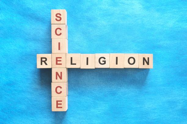 istock Science and religion relationship and interconnection concept. Crossword puzzle flat lay in blue background. 2150242008