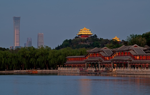 When sun goes down, cityscape of Beijing looks totally different with vibrant lights and ancient architecture, especially public park such Beihai provide tremendous view over city.