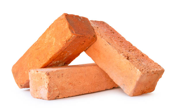 istock Front view of red or orange bricks in stack isolated on white background with clipping path 2150246871