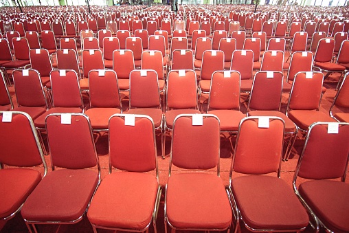 Rows of empty concert hall seats background. Cancelled events background.