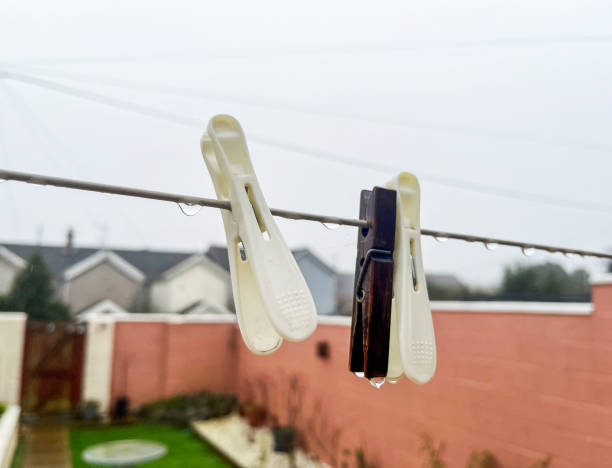 Pegs on clothesline rainy day