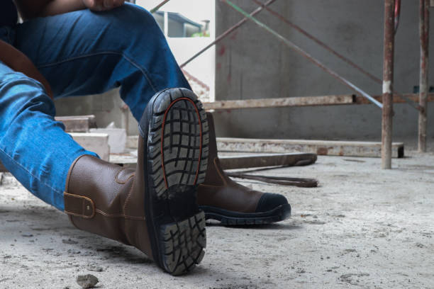 istock A construction worker wearing brown leather safety boots is taking a break 2150249045