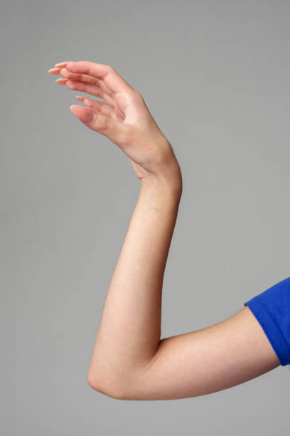 istock Female hand sign against gray background in studio 2150249226