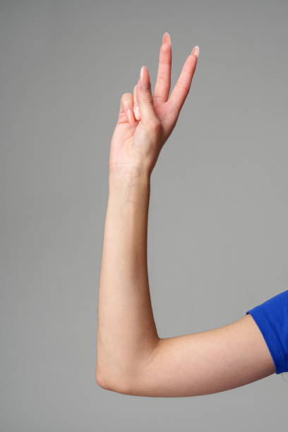 istock Female hand sign against gray background in studio 2150249658