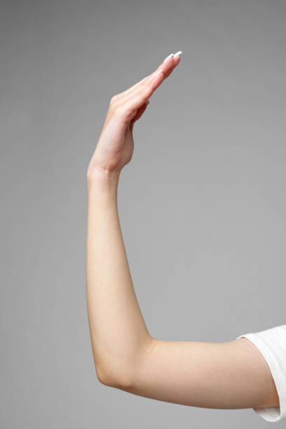 istock Female hand gesturing sign against gray background 2150250093