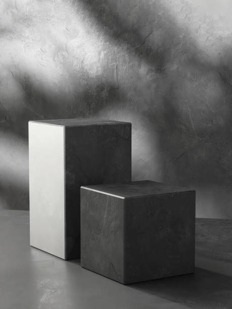istock Two modern black cuboid stone rock podium, geometric pedestal on gray counter 2150251632