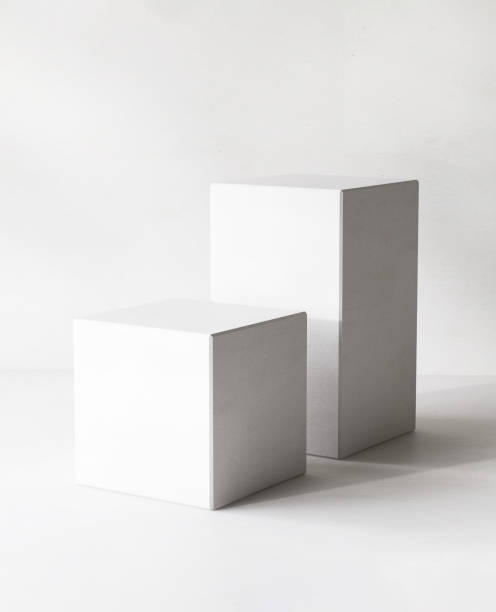 istock Two modern white cuboid podium, geometric pedestal on counter in sunlight 2150251635