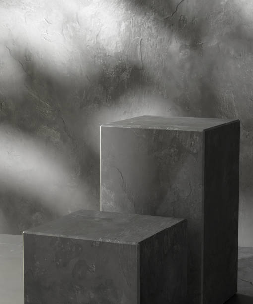 istock Two modern black cuboid stone rock podium, geometric pedestal on gray counter 2150251637