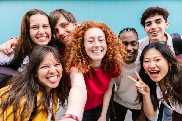 istock Diverse student friends group bonding together outdoors 2150251776