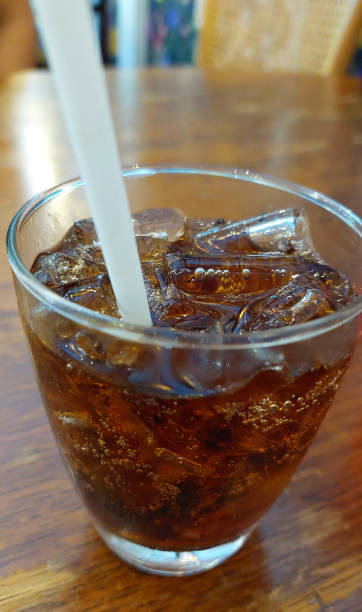 istock Cool Cola Served Over Ice on Wooden Table, Restaurant in Bangkok. 2150255678