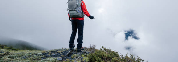 istock Hiking woman on high altitude mountain top 2150257977