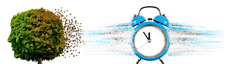 Abstract image of a clock with particles coming off from it and a deoevo with a crown in the form of a human head with leaves coming off on a white background