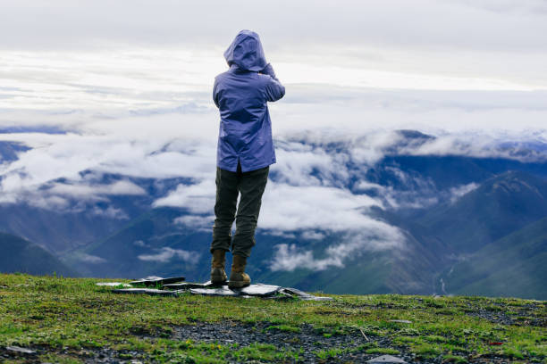 Successful hiker enjoy the view on mountain top