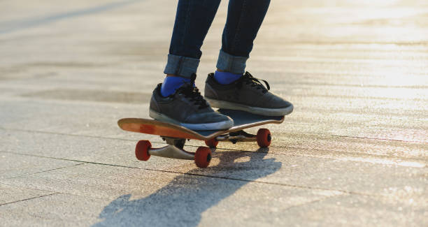 istock Skateboarder skateboarding outdoors in sunshine 2150259243