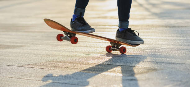 istock Skateboarder skateboarding outdoors in sunshine 2150259312