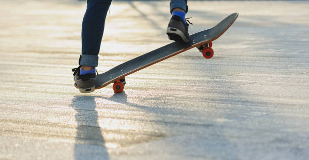 istock Skateboarder skateboarding outdoors in sunshine 2150259336