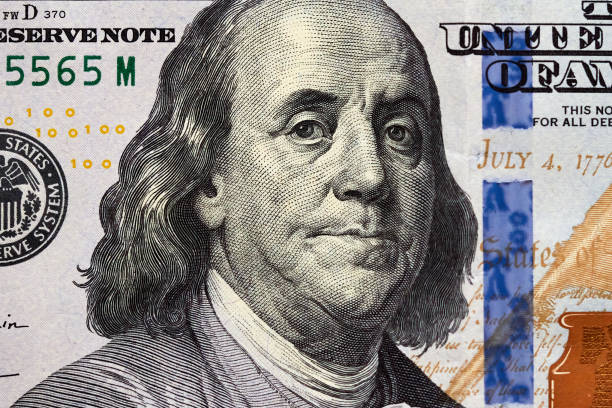 istock Close-up one hundred US dollar bill, top view point 2150259815