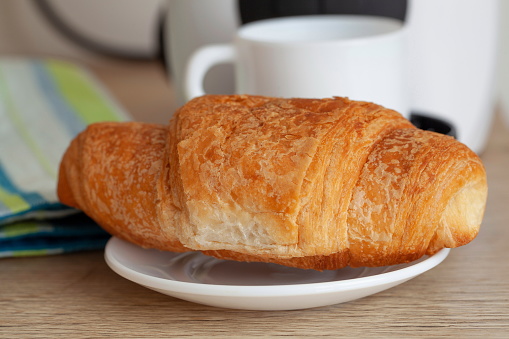 Morning breakfast croissant with coffee
