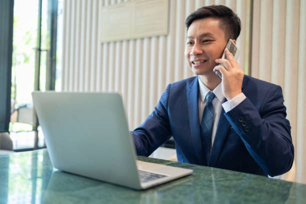 istock Cheerful Businessman Working on Laptop in Office 2150262656