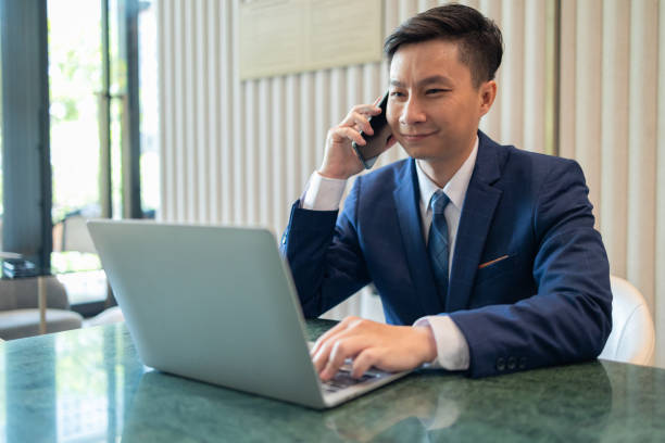 istock Cheerful Businessman Working on Laptop in Office 2150262774