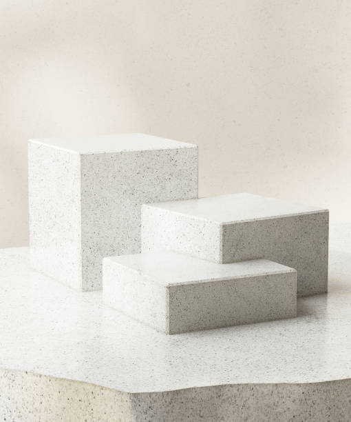 istock Three modern white cuboid terrazzo podium, geometric pedestal on counter 2150266255